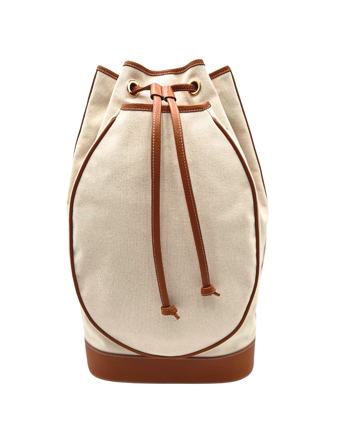 A canvas bucket bag in beige with brown leather trim, drawstring closure, and a brown base, shown against a plain white background.