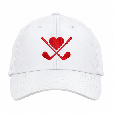 A white baseball cap featuring a red embroidered graphic of two crossed golf clubs with a red heart in the center, set against a plain white background.